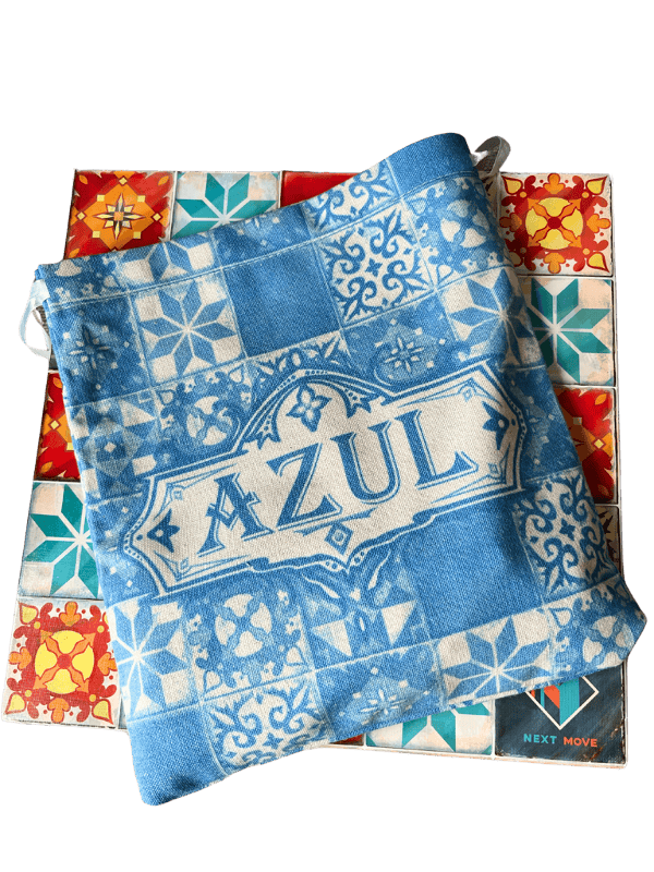 A blue fabric game bag holds unseen Azul tiles, sitting on top of the Azul box